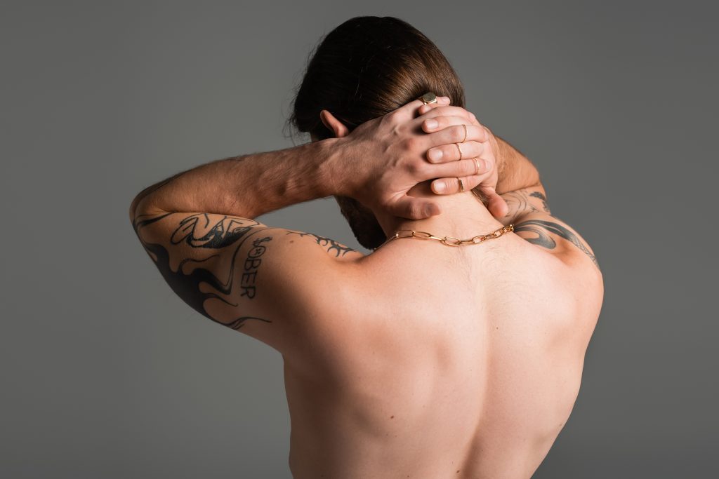 Image of a man's back. Everything Erogenous: The Magic Zones that Will Make Him Tingle